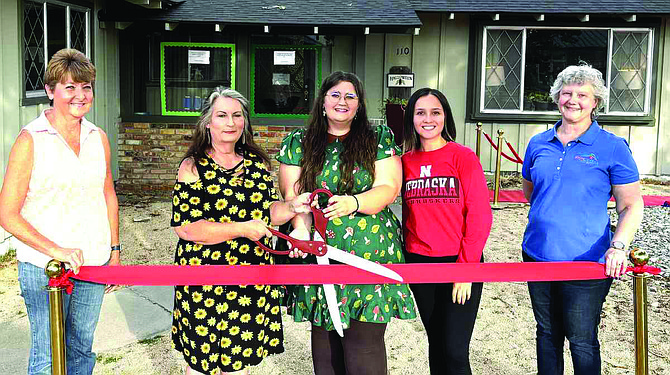 The Fallon Chamber of Commerce hangs the red ribbon to celebrate new member Mother Nature’s Montessori Preschool and Kindergarten. From left: Chamber board member Michelle Gabiola-Rogers, owner, director and teacher Lo’rijane Trigg-Edwards, assistant director Autumn Howe, assistant teacher Ashleigh Hernandez and Chamber board member Merlene Ward.