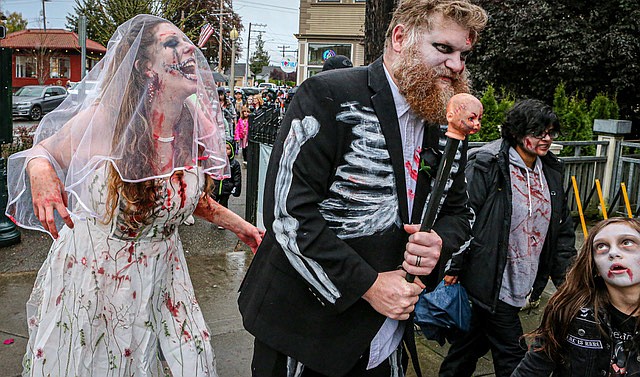 Michael Jackson’s  “Thriller” was the soundtrack as un-known and un-dead zombies lurched and growled their way down First Street of Snohomish in the tightly organized zombie walk in the late afternoon of Saturday, Oct. 26.