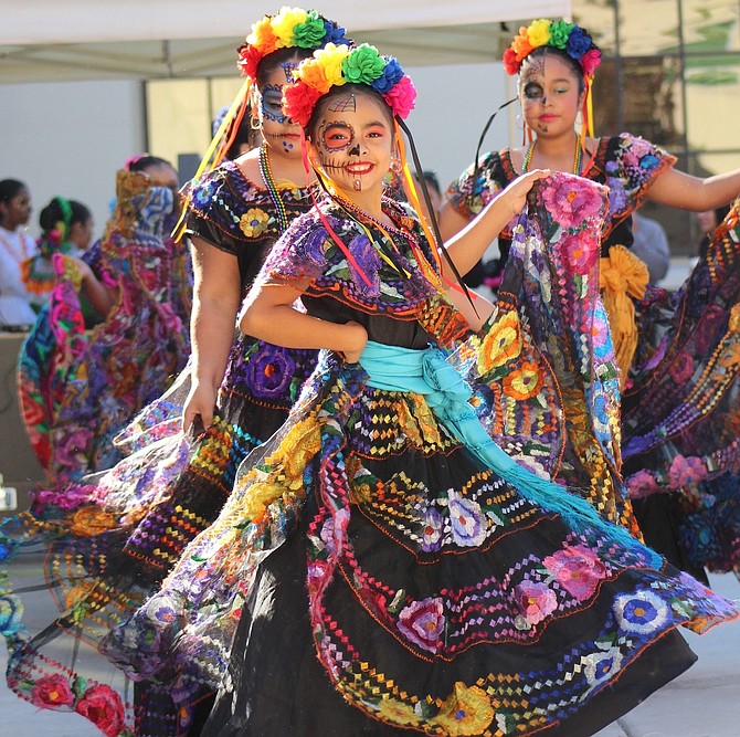 Folk dancers perform during Dia de los Muertos 2023.