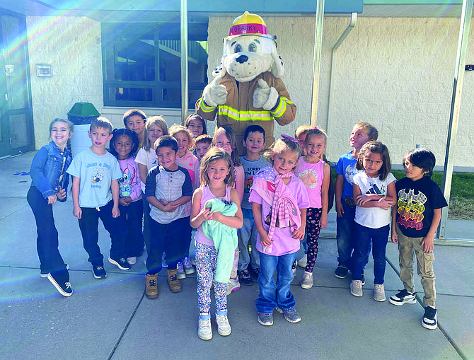 Lahontan students in Shannon Windriver’s class pose with Sparky the fire dog.