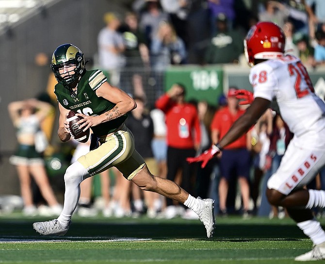 Colorado State quarterback Brayden Fowler-Nicolosi scrambles as New Mexico defender Nigel Williams pursues during the Rams’ win last week.