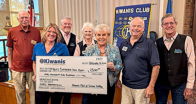 Kiwaninian Past President Bob Wellise, Community Services Director Brook Adie, Foundation members Brian Fitzpatrick and Brenda Robertson, Foundation Chairwoman Renea Louie, Kiwanian and Foundation member Gary Dove and Foundation member Doug Sonnemann.