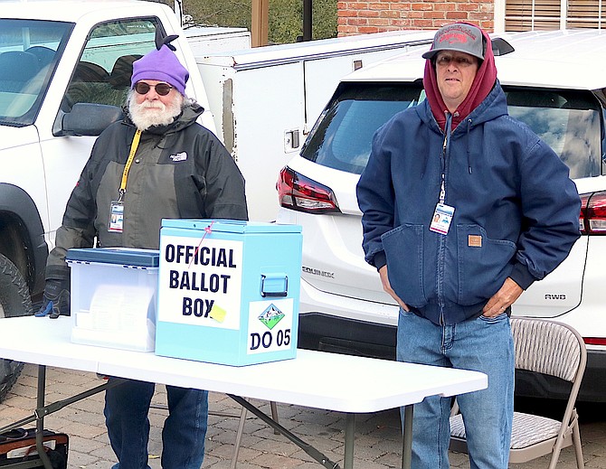 Poll workers Pat Schmid and Luke Ramm tend the ballot box in Genoa, Nevada's oldest precinct on Thursday afternoon. Turnout in the 2024 General Election hit 63.8 percent for Douglas County.