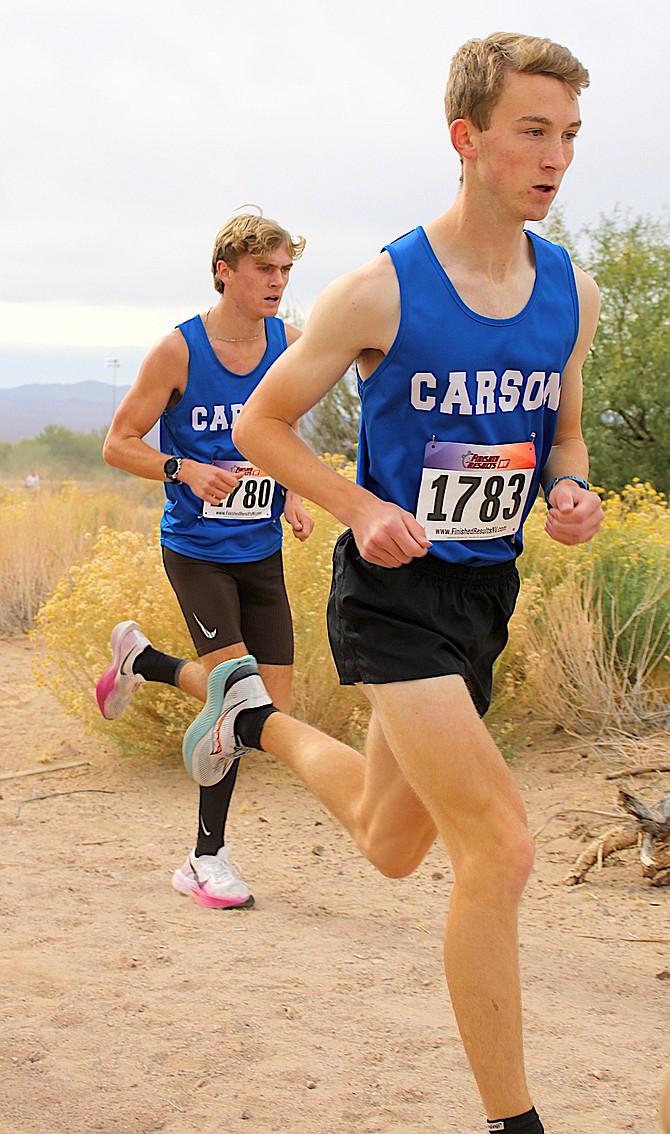 Carson High’s Sean Thornton (near) and Sawyer Macy (far) compete at the Class 5A state cross country meet in Boulder City Saturday. Thornton finished in ninth place as an individual while Macy was 26th.