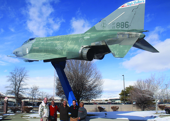 Retired U.S. Air Force Lt. Col. Alexander Turner, second from left, stands underneath an RF-4C (886) he flew in the late 1960s. He and his two sons visited the Nevada Air National Guard base earlier this year. Retired Brig. Gen. Williams Burks of Nevada, left, flew in the same jet as a navigator during Desert Storm in 1991. From left are Burks, Alexander Turner, retired Col. Bryan Turner, Retired Lt. Col. Jeff Zupon and Alex Turner III.