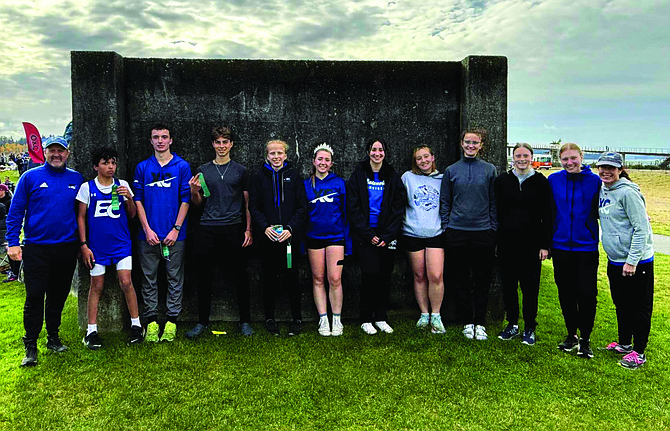 Eatonville's cross country team members that have qualified for the State meet pose with coaches Geoff Olson and Jessica Morrish.