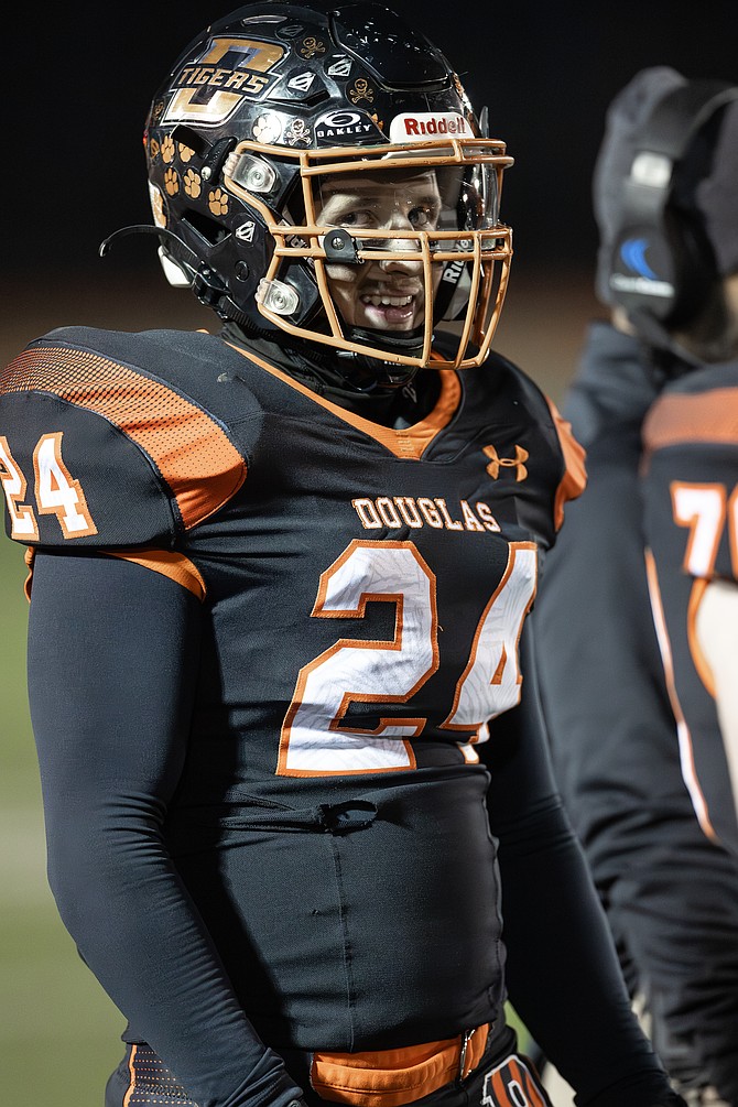 Deivids Balevics smiles during a home game for Douglas High School football this season. Balevics hails from Latvia, but has found a unique place with the Tigers this fall.