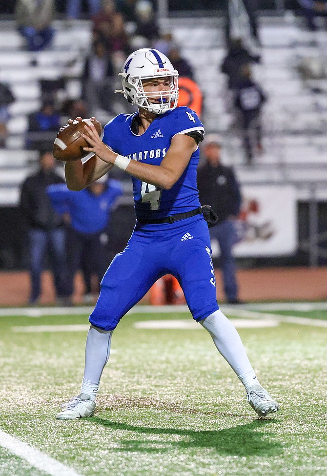 Carson quarterback Drake Hardcastle looks to throw against Damonte Ranch during the teams’ regular-season meeting. Hardcastle and the rest of the Senators are hoping they can defeat the Mustangs in a postseason rematch to reach next week’s regional title game.