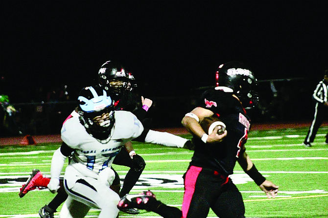 The Pershing County and Coral Academy football teams clash on the field on senior night in Lovelock on Friday.