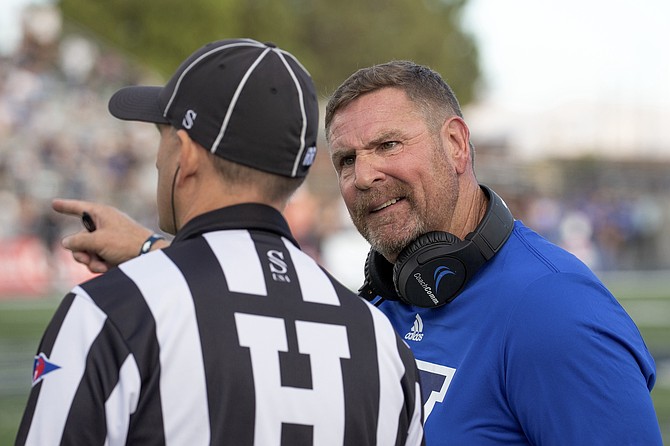 Nevada head coach Jeff Choate talks to an official during the Wolf Pack’s game against Oregon State on Oct. 12.