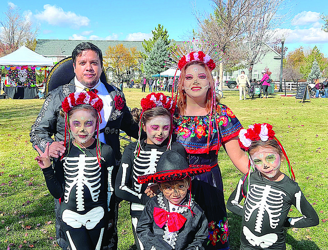 Gardnerville Ranchos residents Martin, Athena, Thalia, Ariel, Matteo, and Zarina Chavez are dressed up for the Dia De Los Muertos Festival at Heritage Park in Gardnerville on Saturday.