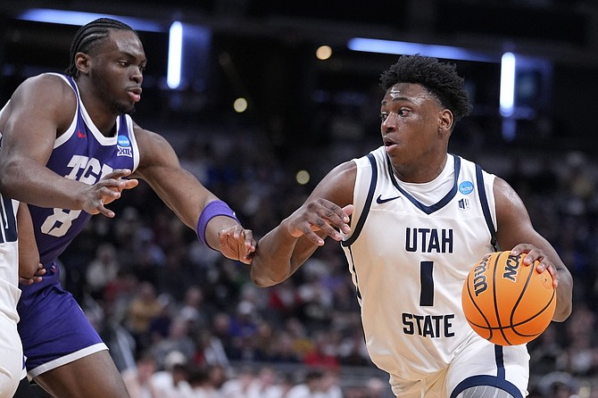 Great Osobor (1), shown last season at Utah State, is expected to be Washington’s pivotal player this season.