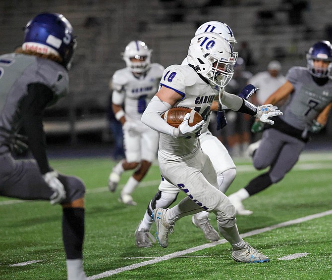 Carson High's Ethan Hendee looks for a lane against Damonte Ranch Friday night, during the Class 5A North Div. III regional semifinal.