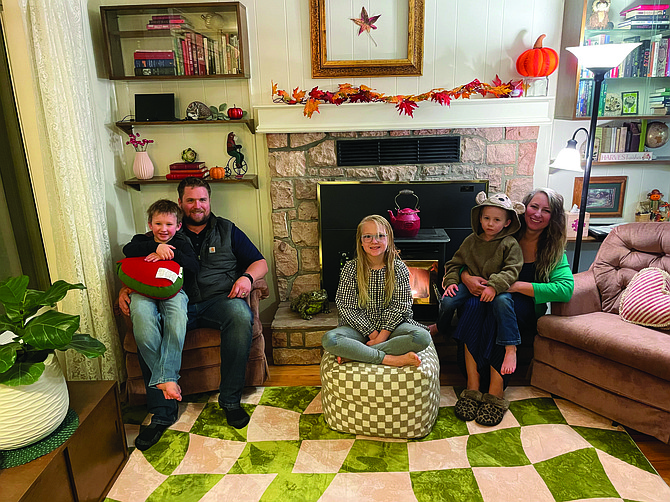 The Klug family in their new home in downtown Carson City on Nov. 4. From left, Ronan, 6, sitting with Jason Klug, Daisy, 8, and Ira, 4, sitting with Brenda Klug.