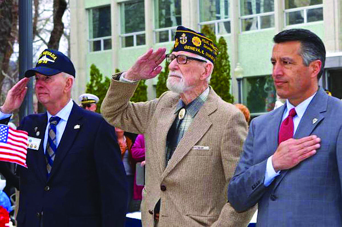 Charles Sehe, right, a World War II veteran aboard the USS Nevada, prepares to lay a wreath at the ship’s memorial behind the Nevada state capitol building in March 2016. With him is Bud Southard from the Carson City Council of the United States Navy League.