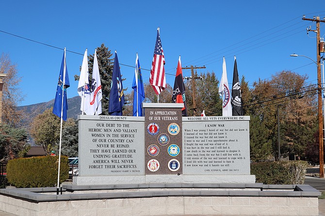 Flags fly over the Veterans Memorial at the Douglas County Courthouse in Minden. Federal, state and local offices will be closed Monday for Veterans Day.