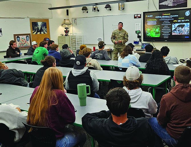 U.S. Army Sgt. Garrett Archuleta, speaks with Brooke Hill's and Jeremy Sivers' combined senior government and economics classes.