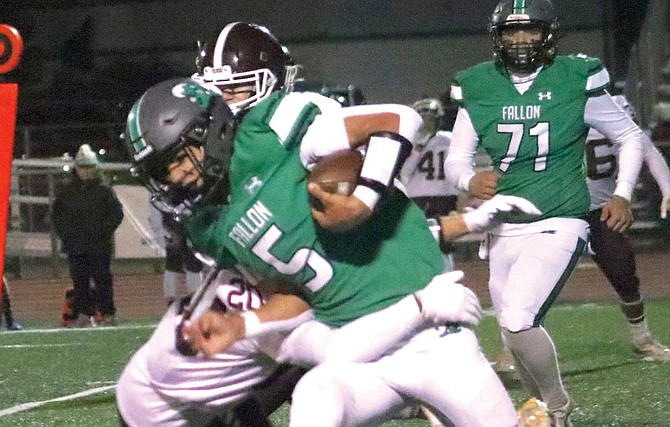 Fallon quarterback Matthew Bird picks up some tough yards against Elko on Friday.