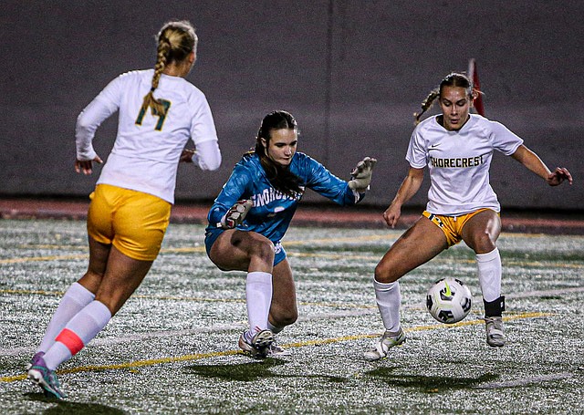 Shorecrest Scots senior Bria Metcalf-Lindenburger (left) and sophomore Olivia Taylor  swarm Snohomish High’s goalkeeper senior Caitlyn Gustatson during the 3A Districts game at Snohomish High on Tuesday, Nov. 5. The Scots had a smooth 2 - 0 win to advance in Districts. Two nights later, Shorecrest downed the Monroe Bearcats 4-1. Snohomish and Monroe are both out. The Panthers finished the season 12-5-0.
The Everett Seagulls, meanwhile, fell to Mountlake Terrace with a 2-1 loss Nov. 5. 
In 4A, the Lake Stevens Vikings got through to a State championship berth.