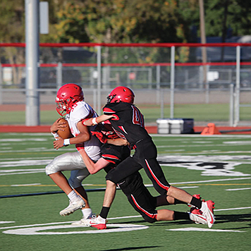 The Pershing County JV football team plays early in their season.