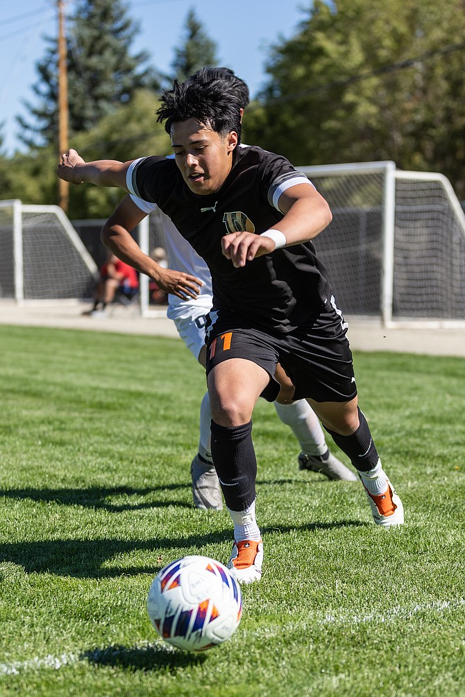 Douglas High’s Diego Diaz sprints down the sideline during a home game this fall. Diaz was selected as a Class 5A North Sierra League honorable mention.