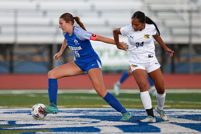 Carson High’s Makayla Rabideau gets away from a defender during a game this fall. Rabideau earned first-team all-league honors for her play this season.