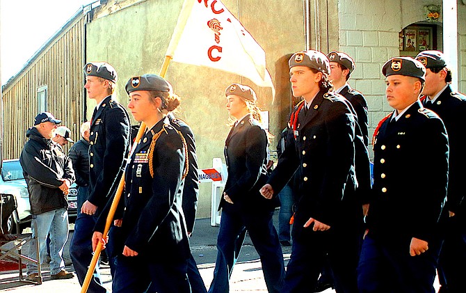 Members of the Douglas High School Jr. ROTC march in the Virginia City Veterans Day Parade on Monday.