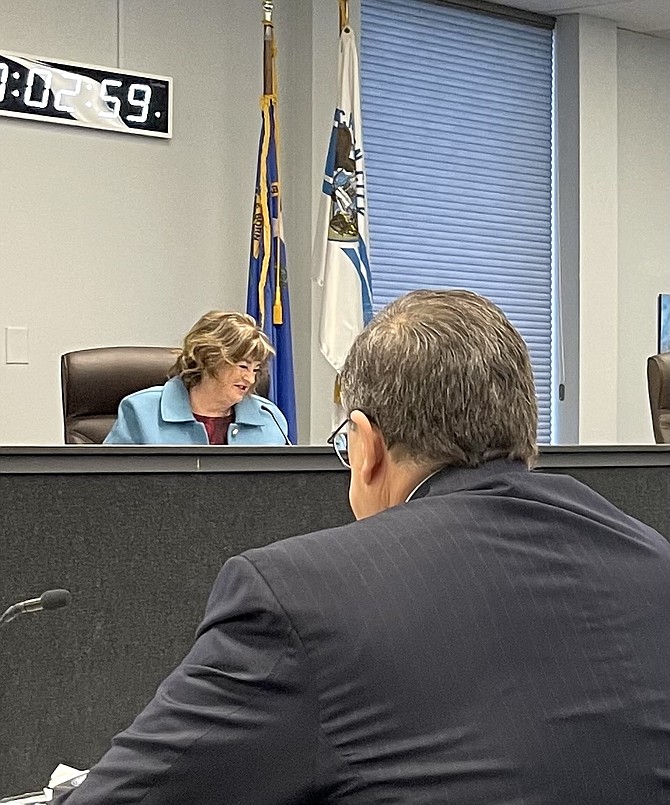 In the background, Carson City Mayor Lori Bagwell, who won reelection, listening to Clerk-Recorder Scott Hoen at the canvass of the vote Friday.