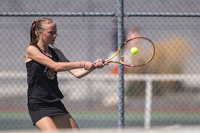 Kiley Girdner of Douglas girls tennis lines up a backhand during a regular-season match. Girdner earned an honorable mention selection on the 4A North all-region tennis teams.