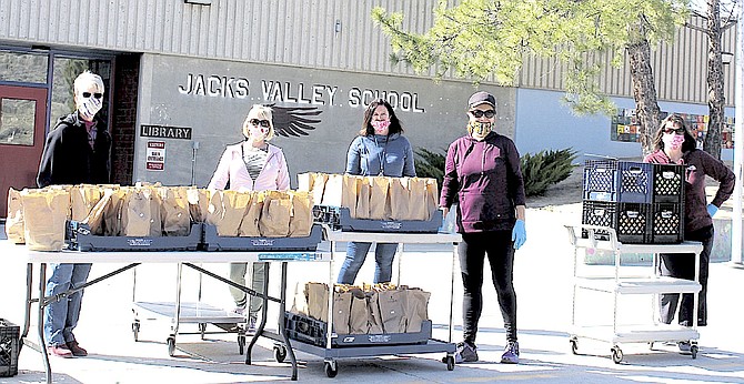 Jacks Valley Elementary School staff prepare to distribute lunches to students in April 2020 after the pandemic resulted in closing the schools.