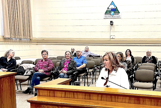 Douglas County Clerk-Treasurer Amy Burgans answers questions on Friday as members of her election staff sit in the audience.