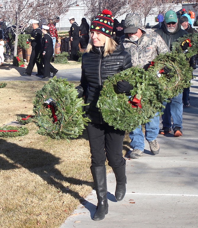 The Wreaths Across America remembrance ceremony is Dec. 14 at the Northern Nevada Veterans Memorial Cemetery in Fernley and at other cemeteries across Northern Nevada. Scores of volunteers assisted with the placement of wreaths in 2023.