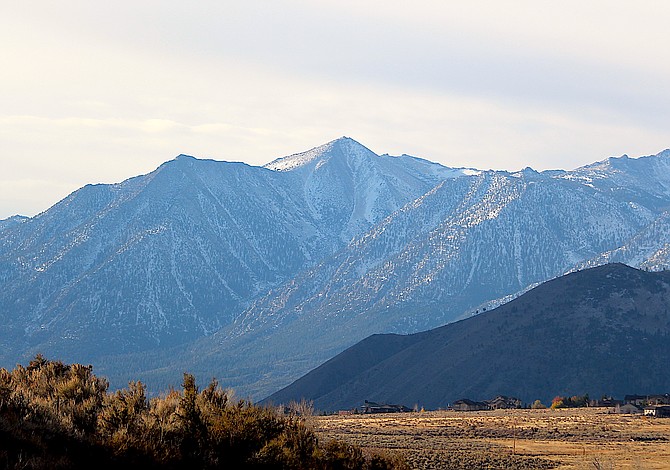 Thin clouds blow over Jobs Peak as power was shut off to 42 NV Energy customers along Jacks Valley Road on Wednesday morning.