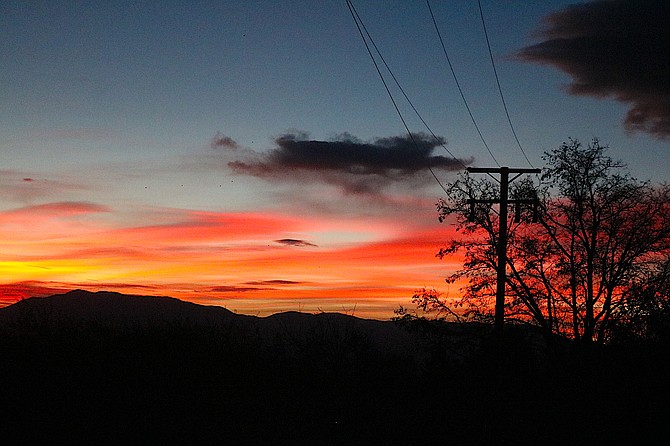 Sunrise over the Pine Nut Mountains on Wednesday morning as a storm arrives on Wednesday morning.