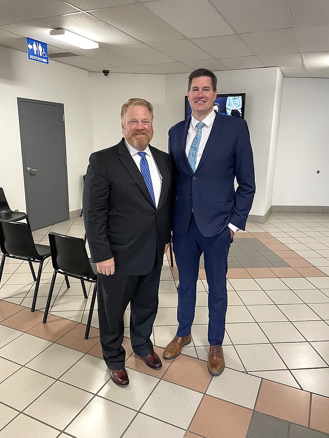 Incoming First Judicial District Court Judge Jason Woodbury, left, with newly-appointed Carson City District Attorney Garrit Pruyt in the lobby of the community center Nov. 21, 2024.