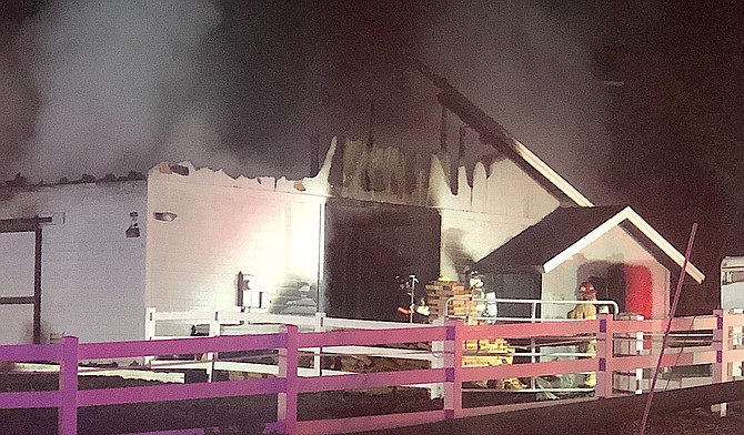 Smoke rises from an early morning barn fire on Centennial Drive in Genoa early Monday morning. East Fork Fire Protection District photo