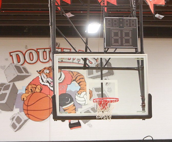 A shot clock sits above the backboard at Douglas High School. Shot clocks will be new to Nevada this season and can be used in all non-league games.