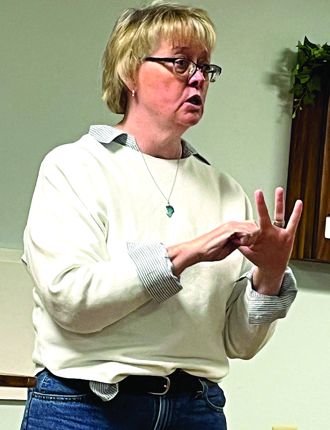 Nevada Department of Veterans Services Director Mary Devine speaks to Nevada Army National Guard retirees at their December breakfast about the services her agency offers.