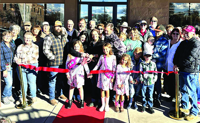 Rachelle Gomes, left, and Katrena Wenger cut the red ribbon together for The Rusted Rose Western Boutique’s grand opening at 131 S. Maine St. number 101 on Nov. 23. The Fallon Chamber of Commerce hosted the grand opening and ribbon cutting.