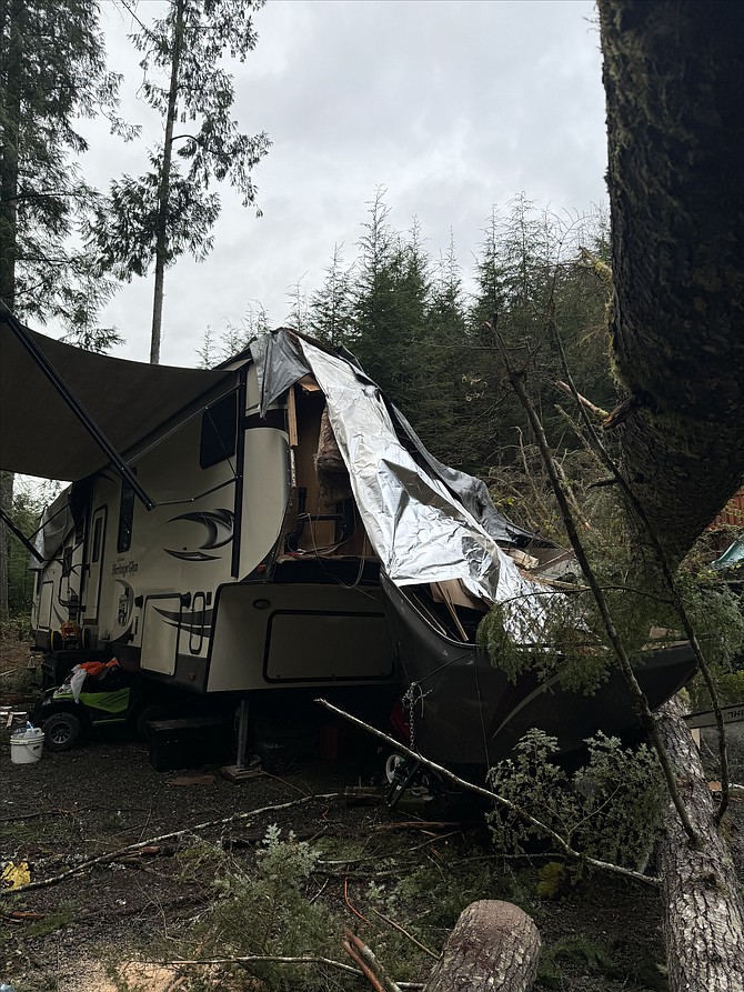 A big tree fell and ripped much of the family’s 42-foot fifth wheel in Lake Roesiger. Another destroyed one of their cars.