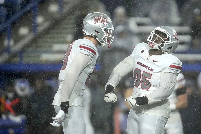 UNLV defensive lineman Alexander Whitmore (right) reacts after a tackle against San Jose State on Nov. 22, 2024 in San Jose, Calif.