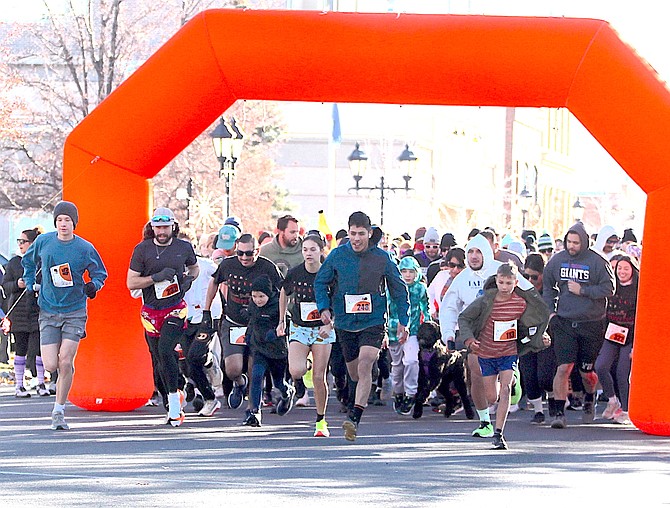 Turkey trotters start the annual run on Thanksgiving morning.