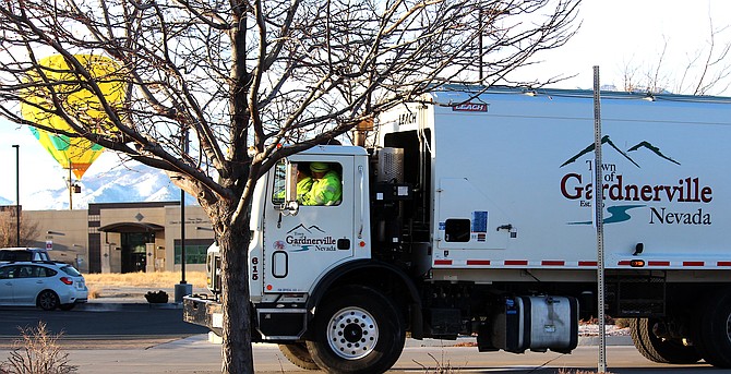 Gardnerville sanitation workers make their rounds through the Grant Avenue Walmart parking lot on Nov. 29.