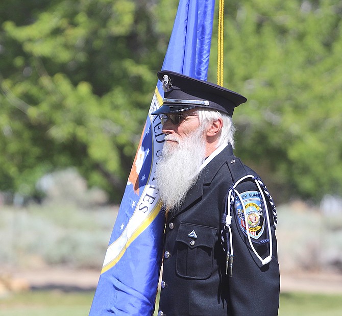 A member of The Northern Nevada All Veteran Honor Guard marches in the colors at the Vietnam Traveling Wall at Minden’s Eastside Memorial Park in May.