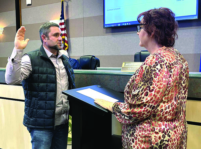 Joseph Frey is sworn into service for a two-year term on the Churchill County Planning Commission on Nov. 20 by Pam Moore, deputy clerk to the Board of Commissioners.