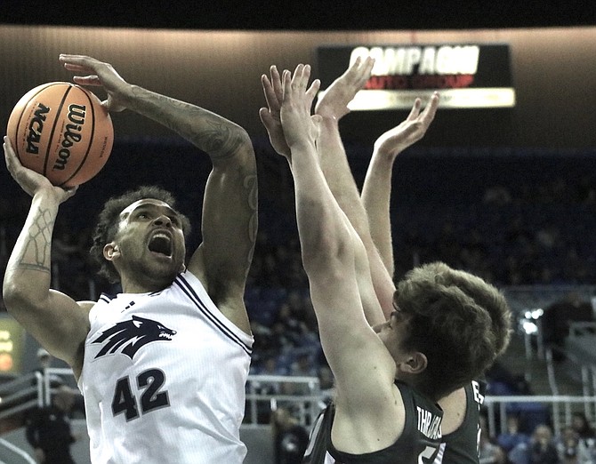 Nevada’s K.J. Hymes goes up for a shot against Washington State in Monday night’s game at Lawlor Events Center. The Cougars defeated Nevada, 68-57.