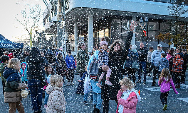 The crowd gets giddy as imitation snow spirals during Everett’s annual Tree Lighting and Santa arrival Saturday, Nov. 29 at Hewitt and Colby avenues, the center of downtown, as part of its month-long Wintertide festivities. 
The event included lighting the traditional tree hoisted on wires above Hewitt and Colby, a visit and photo shoot with the Ice Princesses, and Santa roving the area.   
More activities can be found on a city website, www.visiteverett.com/wintertide