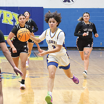 Lowry's Maite Avalos dribbles down the floor on a fast break during Saturday's preseason game with Pyramid Lake in Winnemucca.