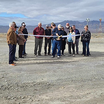 Larry Rackley cut the ribbon at Derby Field Airport.