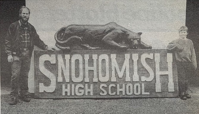 Fred Bero and son, friends of Panther Coach Dick Armstrong, carved this sign and the Panther atop using a chainsaw and rotor, photographed when new in 1993.